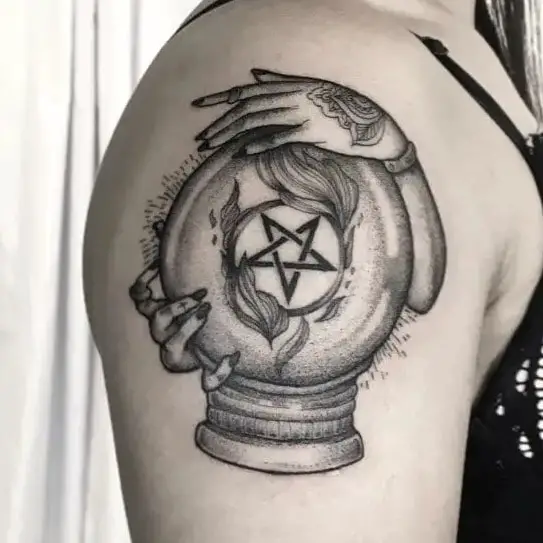 Hands of Witch Holding a Crystal Ball Tattoo
