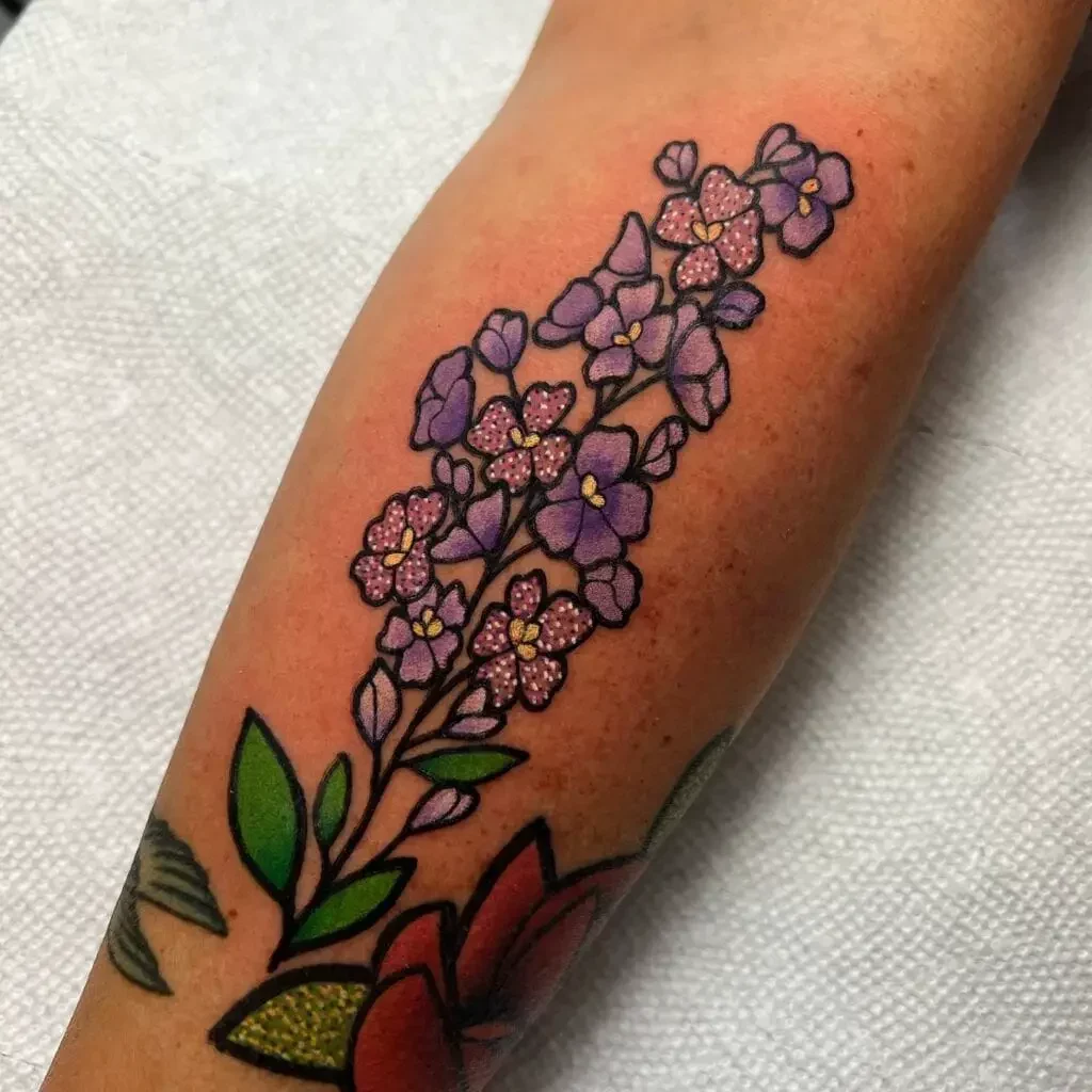 Polka Dots Violet Larkspur Flower Tattoo Design