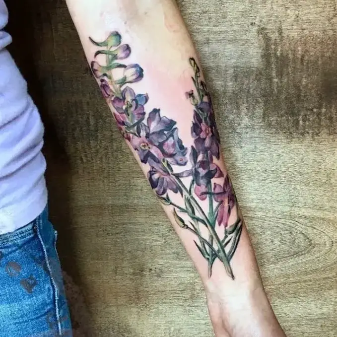 Realistic Colored Larkspur Flower Arm Tattoo Design