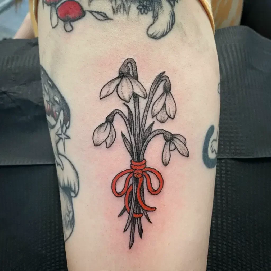 Snowdrop Flower in Red Tie Tattoo Design