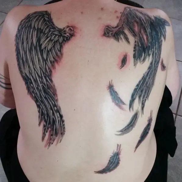 Torn Fallen Angel Wing Back Tattoo