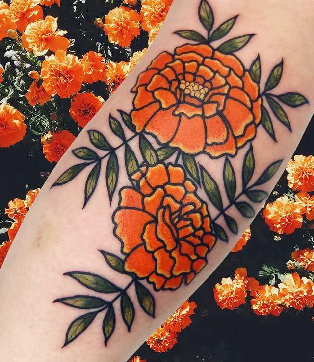 Vibrant Yellow Orange Marigold Flower with Horn Leaves Tattoo