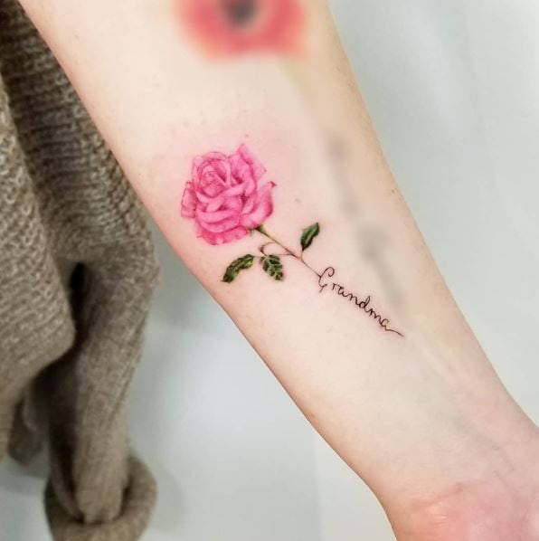 Pink Rose and Black Ink Grandma Text Forearm Tattoo