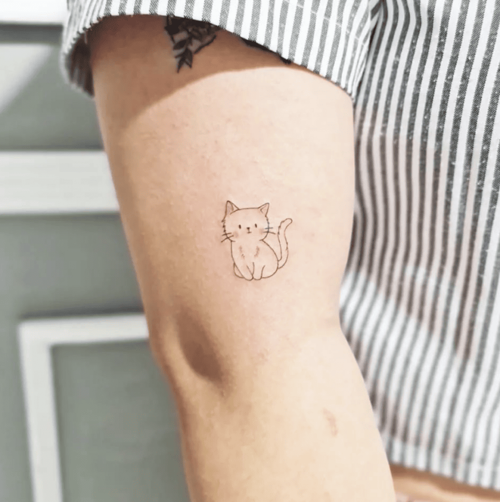 A Cute Blushing Kitten Arm Tattoo