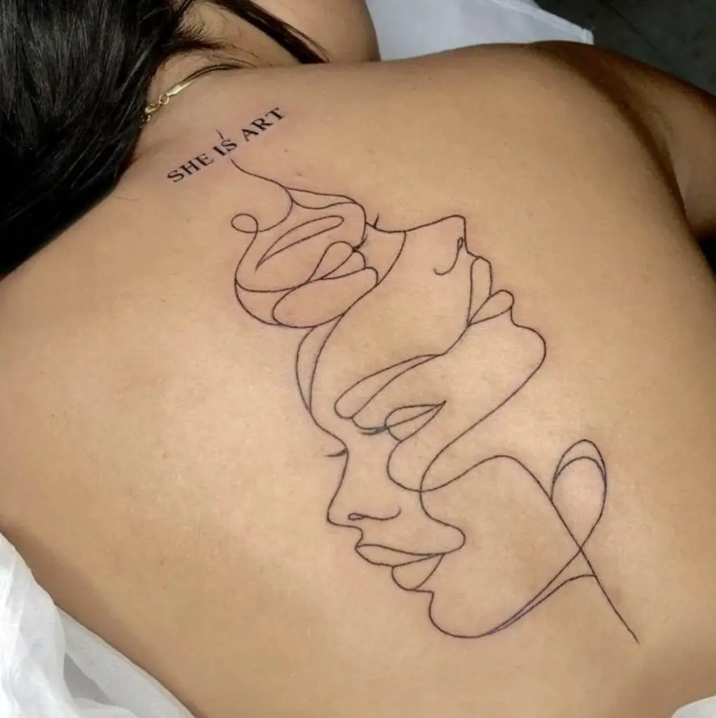 Abstract Faces by One Line With a Text Above Back Tattoo