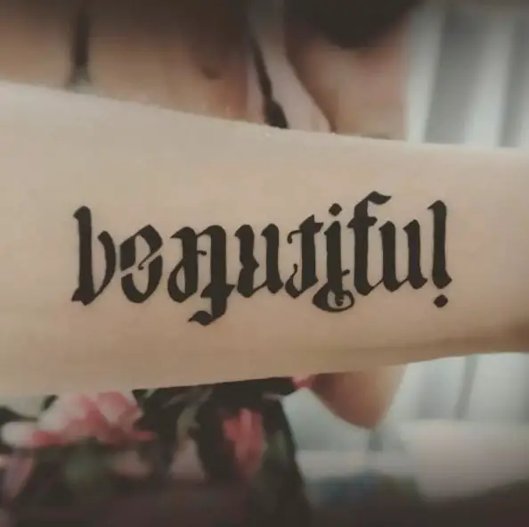 Beautiful and Imperfect Ambigram Tattoo