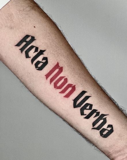 Black and Red Acta Non Verba Lettering Forearm Tattoo