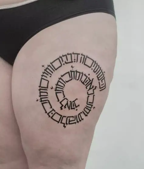 Coiled Hebrew Phrase Thigh Tattoo