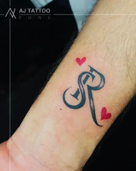 Creative S and R Initials with Tiny Red Hearts Tattoo