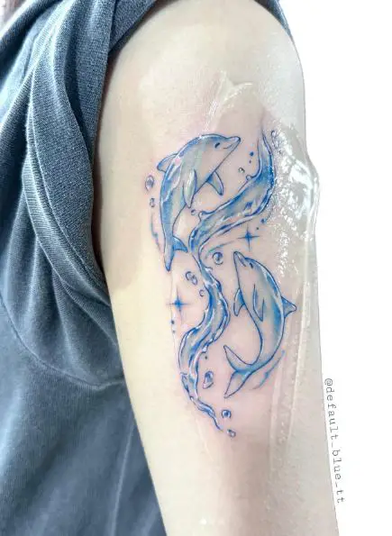 Dance of Happy Dolphins with Waves Arm Tattoo
