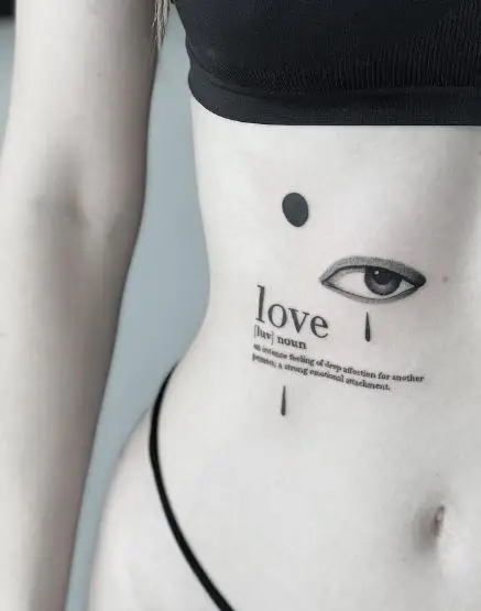 Definition of Love and Eye Rib Tattoo