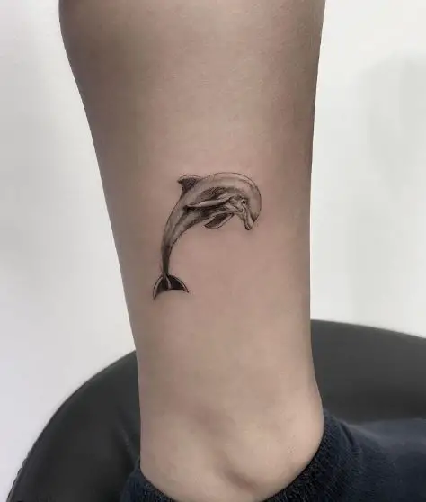 Delicate Realistic Dolphin Ankle Tattoo
