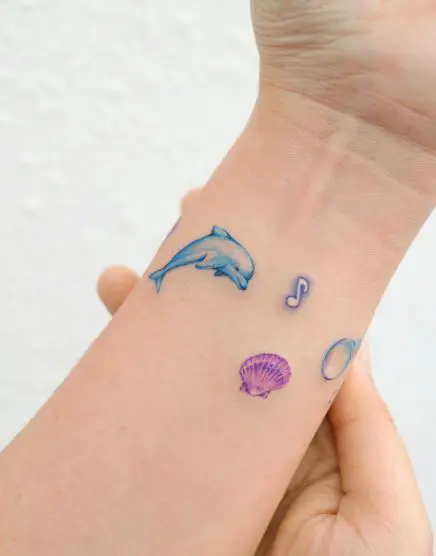 Dolphin, Bubble, Seashell and Note Colored Icons Tattoo