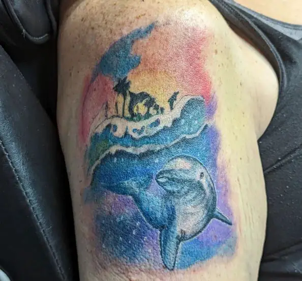 Dolphin Watercolor Arm Tattoo