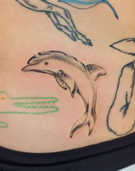Glass Dolphin Belly Tattoo