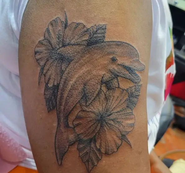 Greyscale Dolphin and Hibiscus Flower Tattoo