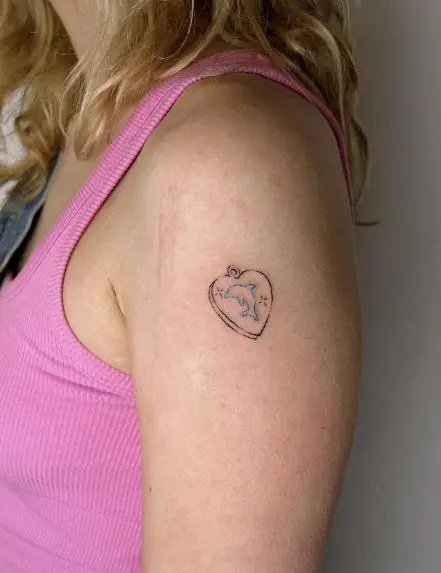 Heart Shaped Pendant and Tiny Dolphin Arm Tattoo