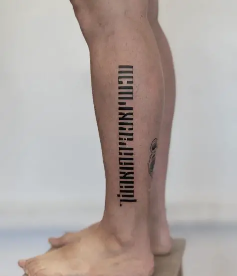 Hebrew Calligraphy Leg Tattoo