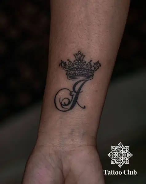 Initial J and Crown Wrist Tattoo