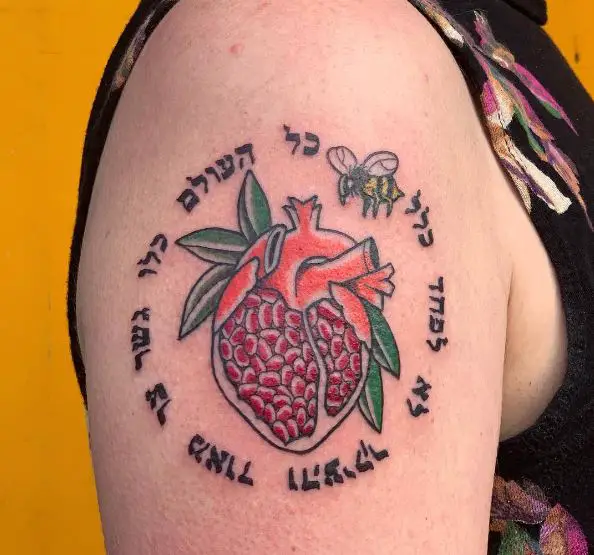 Pomegranate Heart, Bee and Hebrew Phrase Arm Tattoo