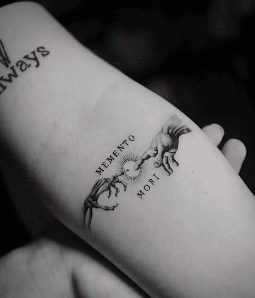 Skeleton Hand and Human Hand in The Style of The Creation of Adam Arm WIth a Text Tattoo