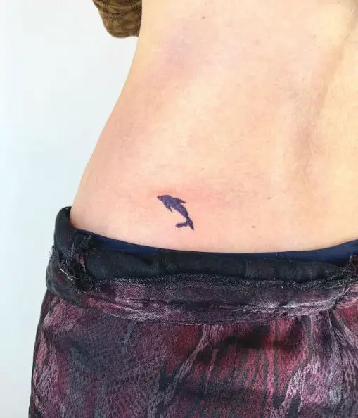 Small Purple Dolphin Tattoo on the Hip
