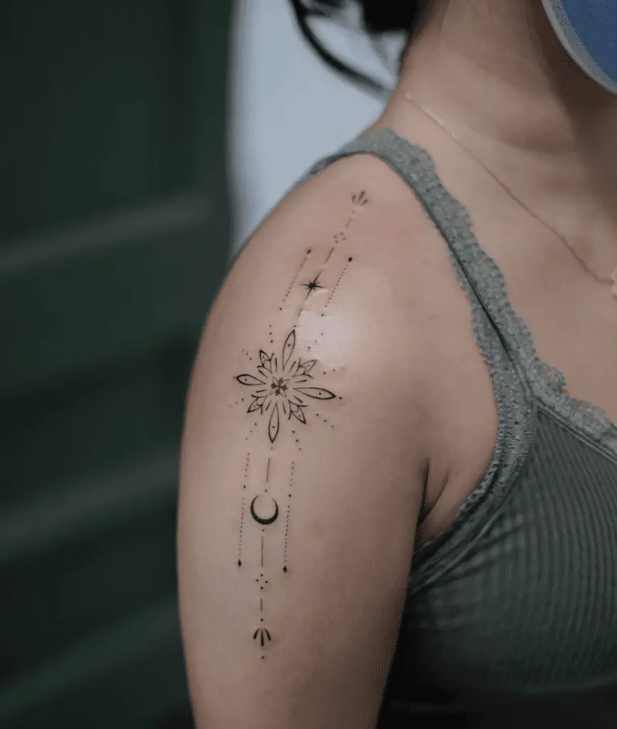 Star Ornamental With Embelishment Elements Uppper Arm Tattoo