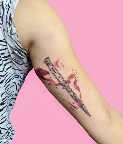 Switchblade with Blood Splash Arm Tattoo
