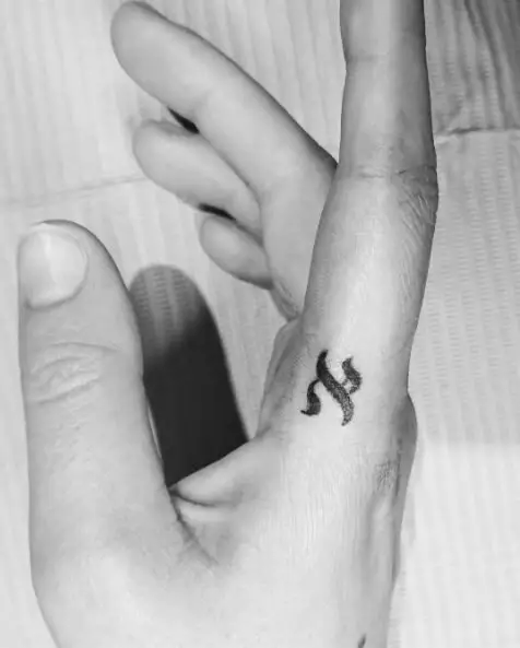 Tiny Aleph Finger Tattoo