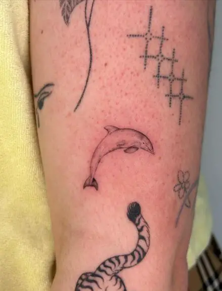 Tiny Dolphin Arm Tattoo