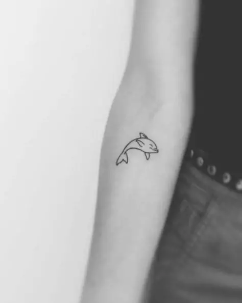 Tiny Dolphin Forearm Tattoo
