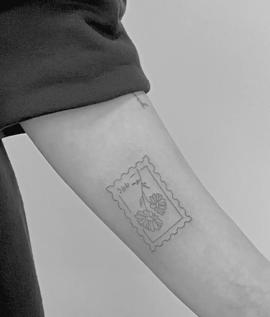 Upside Down Birth Flower Stamp Arm Tattoo