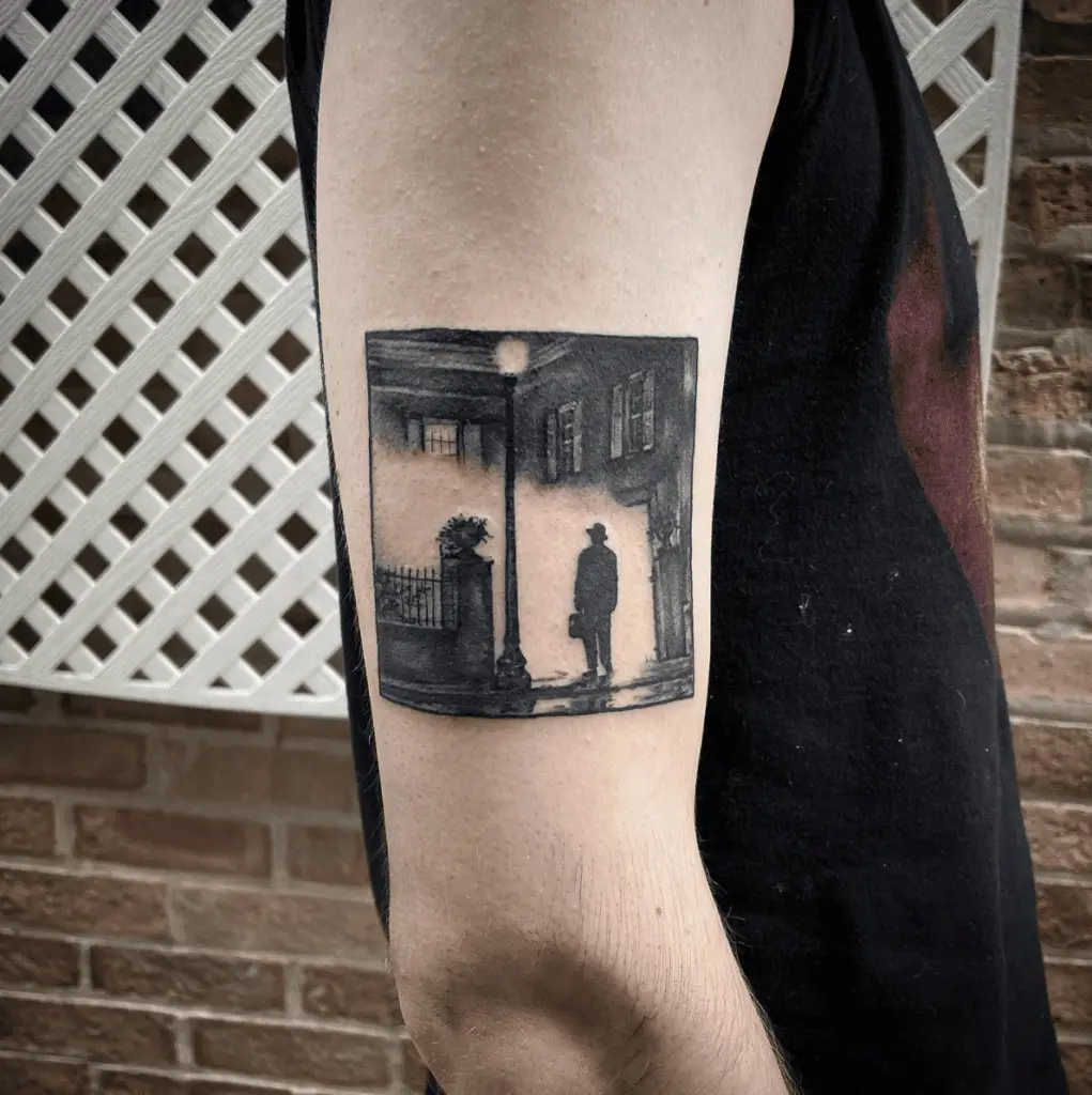 A Hat Man Standing Near The House Arm Tattoo
