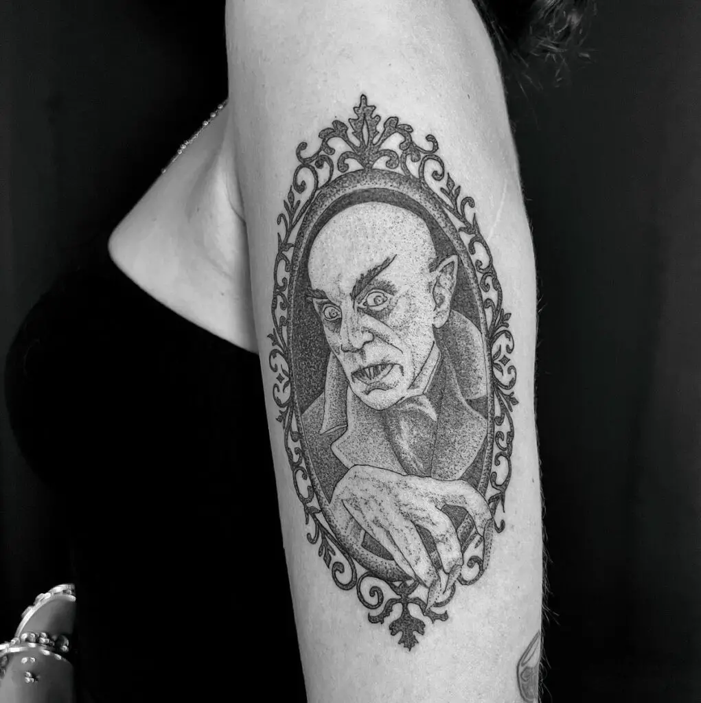Bald Vampire Placed in Vintage Mirror Arm Tattoo