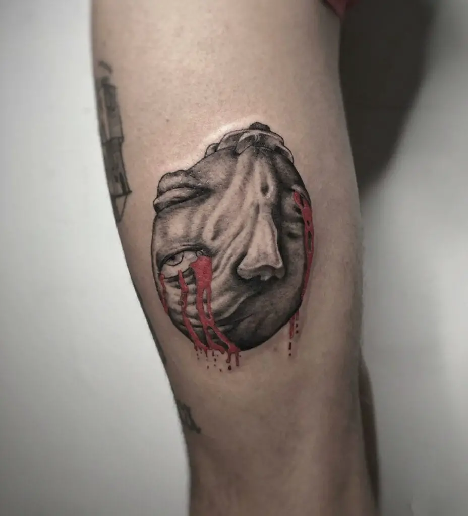 Behelit Red Tears Flowing Up Side Down Leg Tattoo
