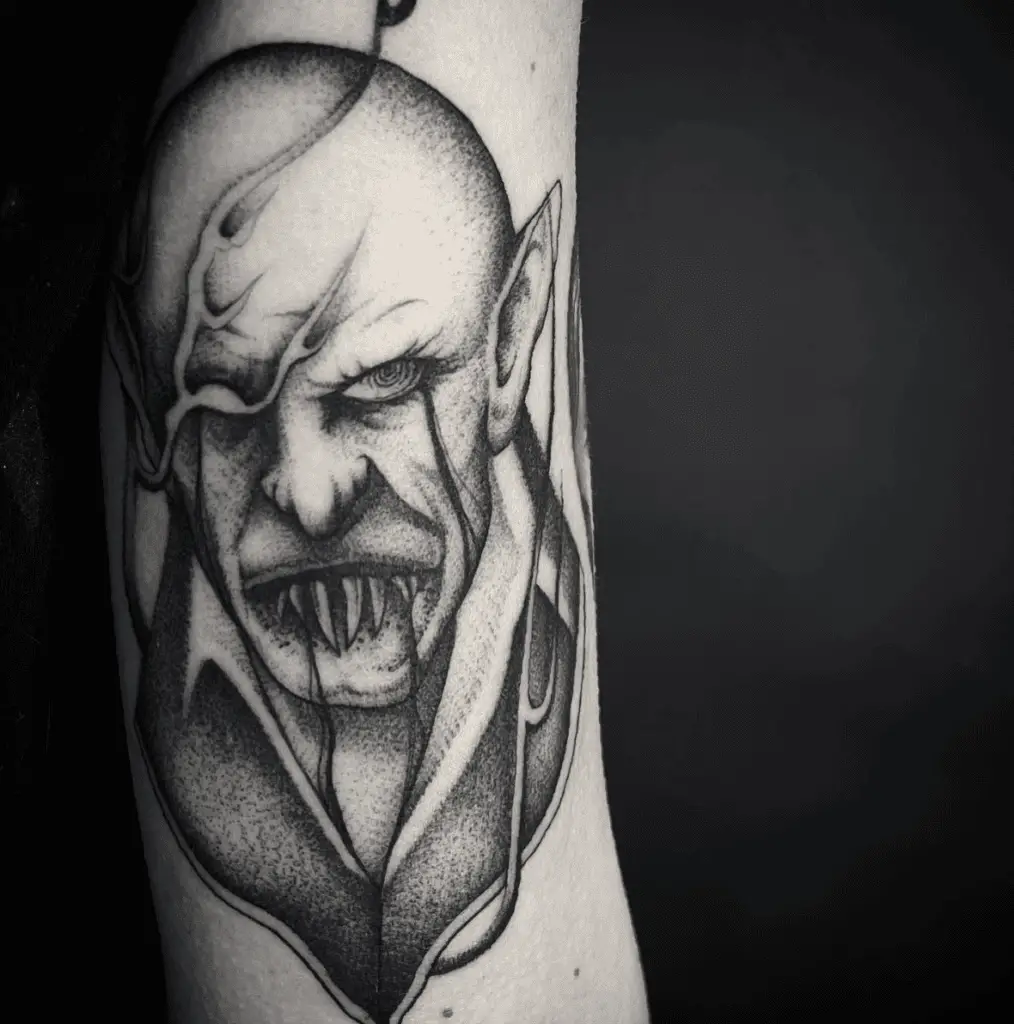 Black Ink Angry Count Orlok Smoke Eye Arm Tattoo