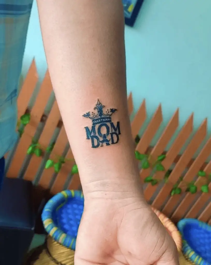 Black Ink Mom and Dad With Royal Crown Wrist Tattoo