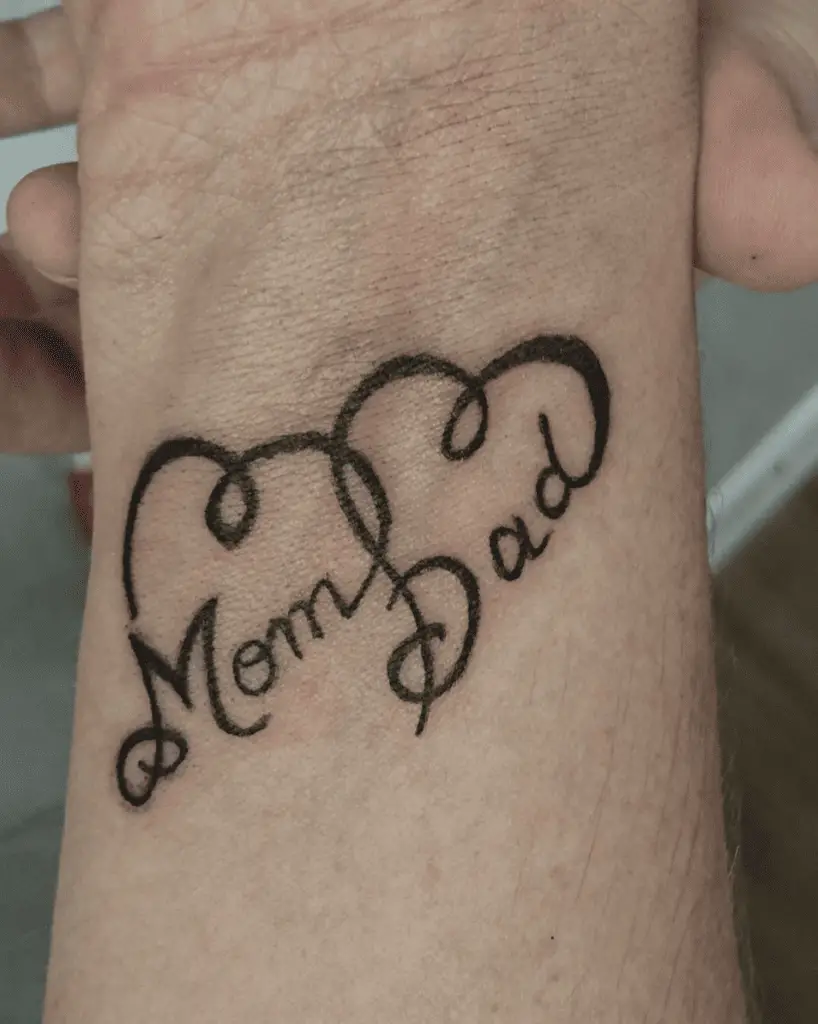 Black Ink Mom and Dad in Heart String Wrist Tattoo