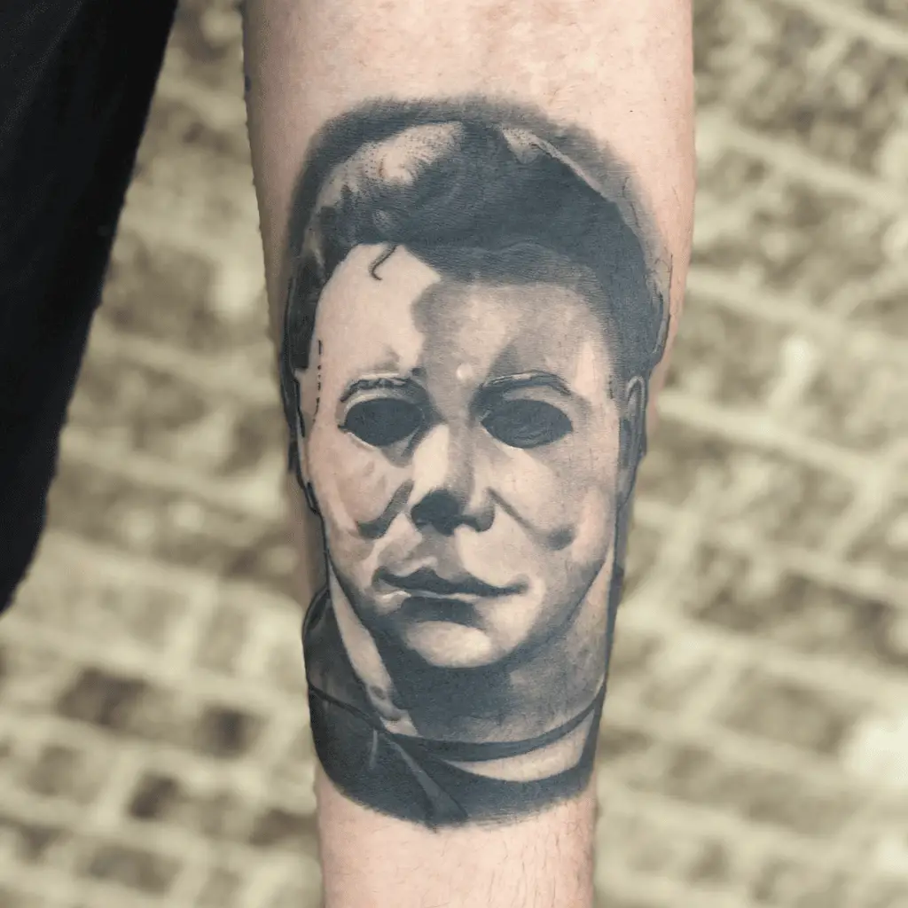 Black and Grey Portrait of Emotionless Masked Man Arm Tattoo