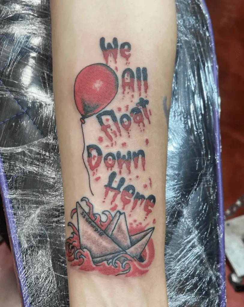 Burning We All Float Down Here Paper Boat With A Red Balloon Surfing On Red Blood Waves Arm Tattoo