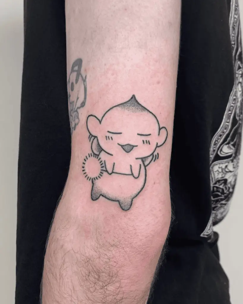 Chestnut Puck Holding a Wishing Flower Arm Tattoo