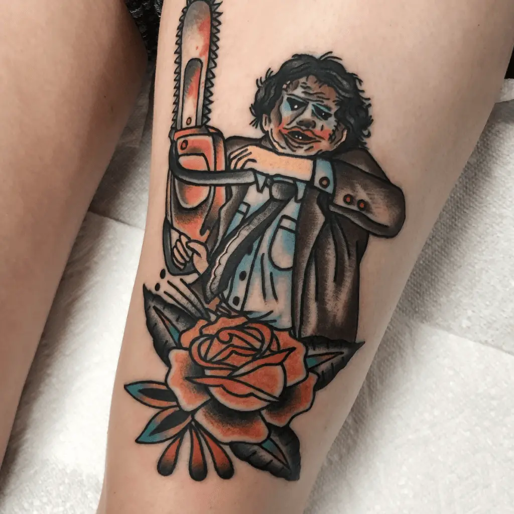 Colored Man Wearing a Mask With Rose Leg Tattoo