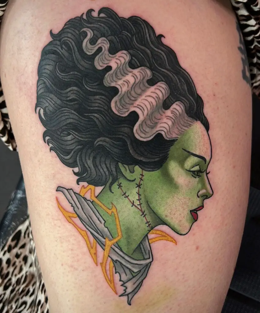 Colored Side Profile of a Woman With Frizzy Hair Thigh Tattoo