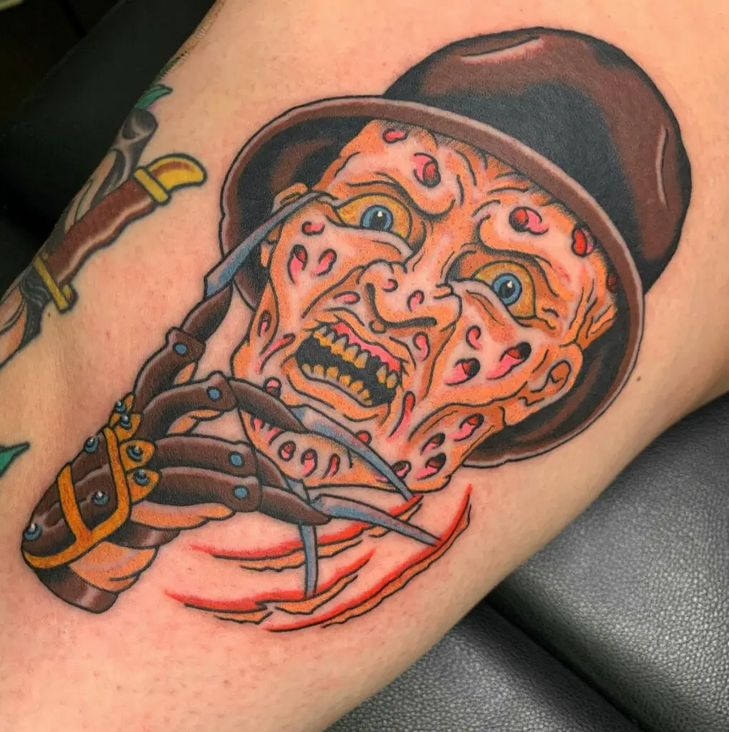 Colored Ugly Man With Hat and Claw Gloves Tattoo