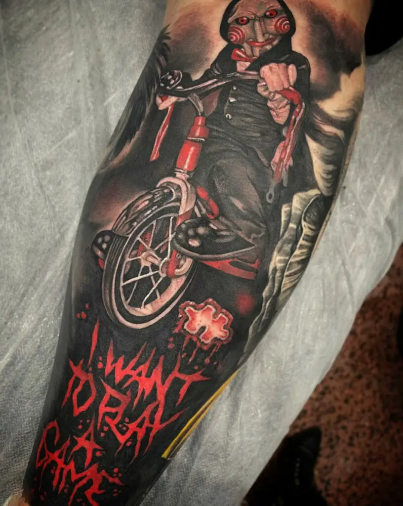 Detailed Jigsaw Riding His Bicycle With Text Arm Tattoo