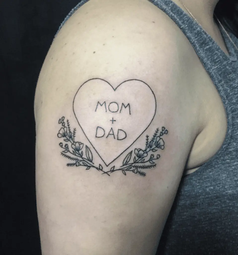 Fine Line Mom and Dad inside a Heart with Flower Stands Upper Arm Tattoo