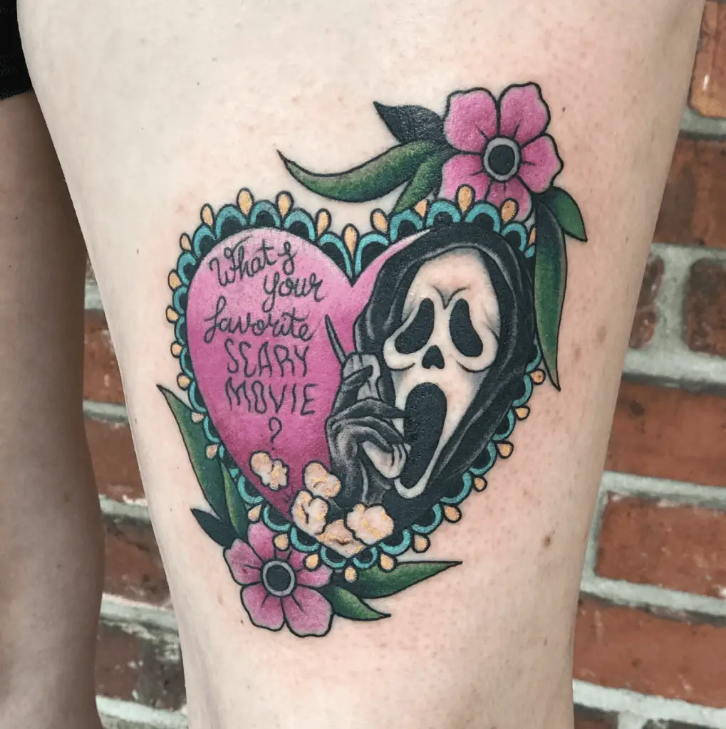 Grim Reaper On A Floral Heart With Text Thigh Tattoo