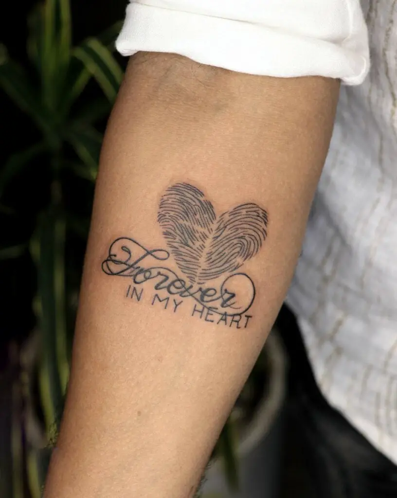 Heart Fingerprint With Text Phrase Arm Tattoo
