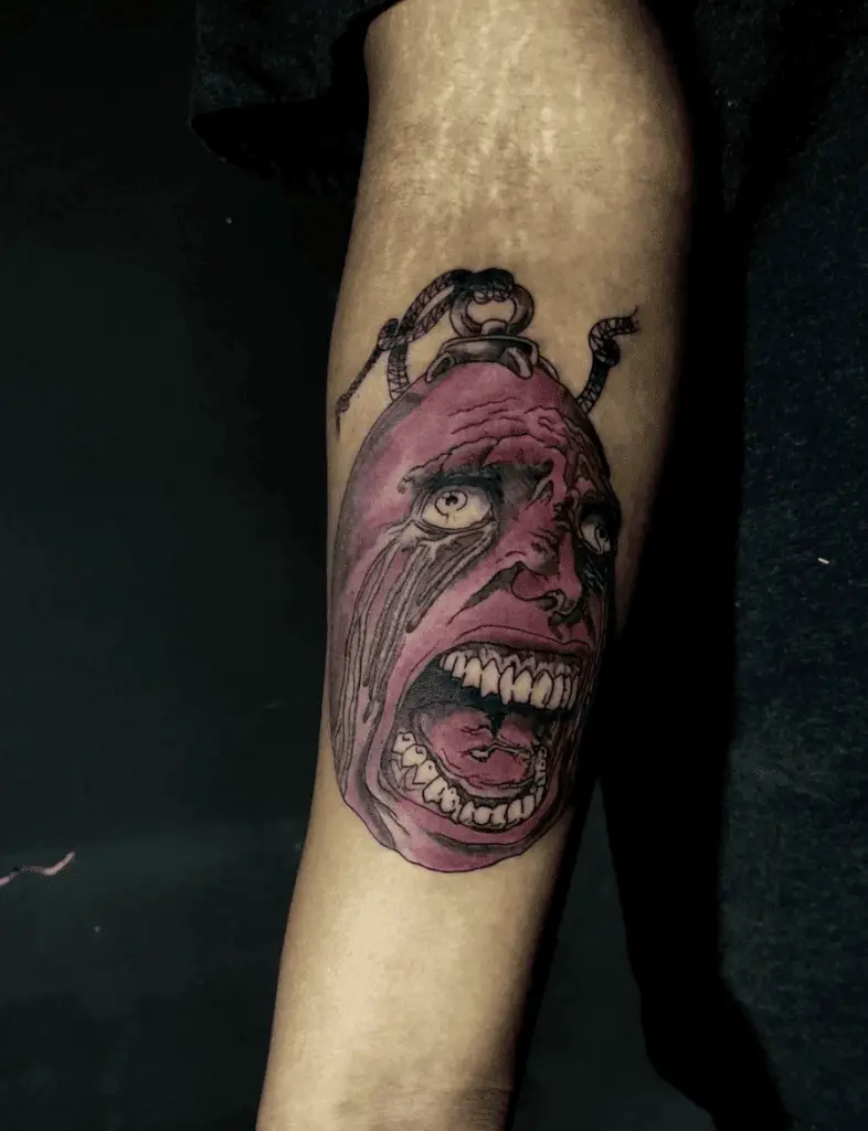Human Face Behelit Crying Arm Tattoo