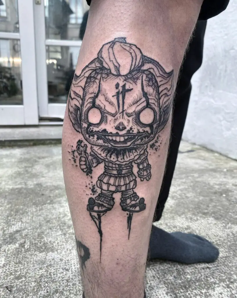 Little Scary Clown Holding A Hand Bone Leg Tattoo